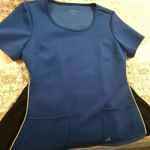 Jaanuu.com medium scrub top in royal blue.